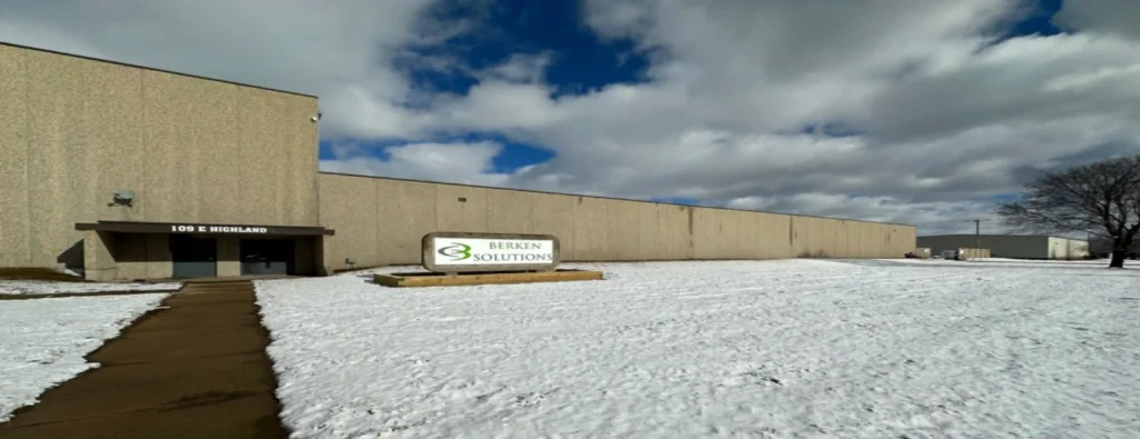 A street view of Berken Solutions' Manufacturing Facility with snow on the ground.