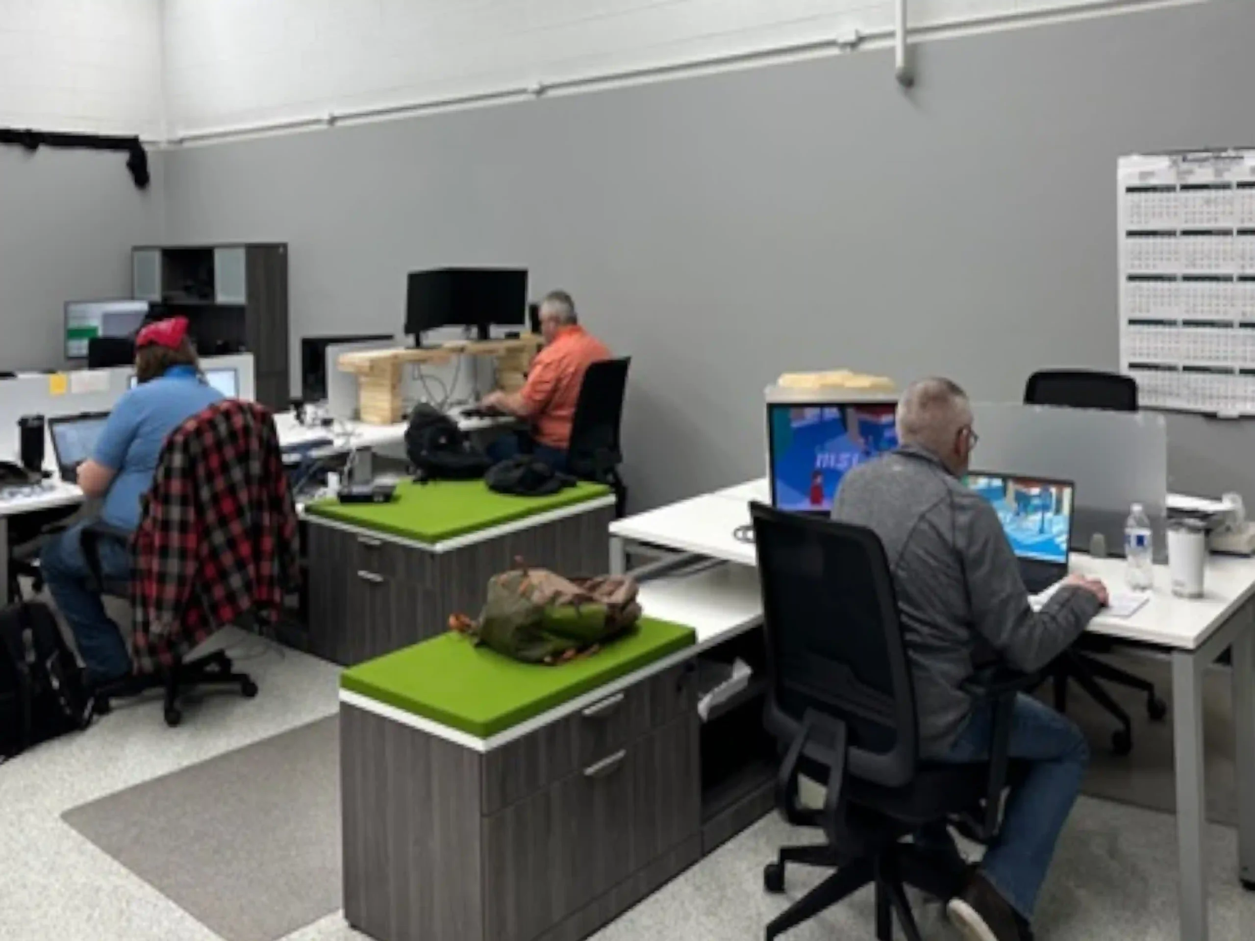 Engineers working on their computers in an office at Berken Solutions.